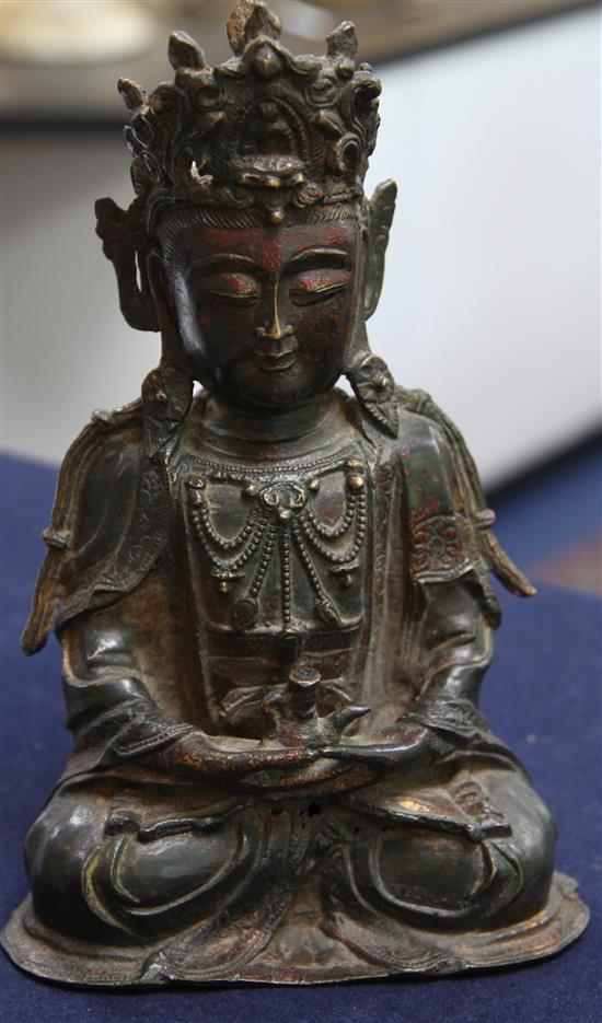 A Chinese lacquered bronze seated figure of Guanyin, possibly Ming dynasty, height 31cm